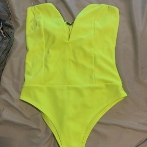 Neon yellow cute body suit never worn.